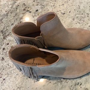 Tan Lucky Brand bootie with fringe.